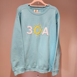 Light Blue Sweatshirt with Sun Embroidery